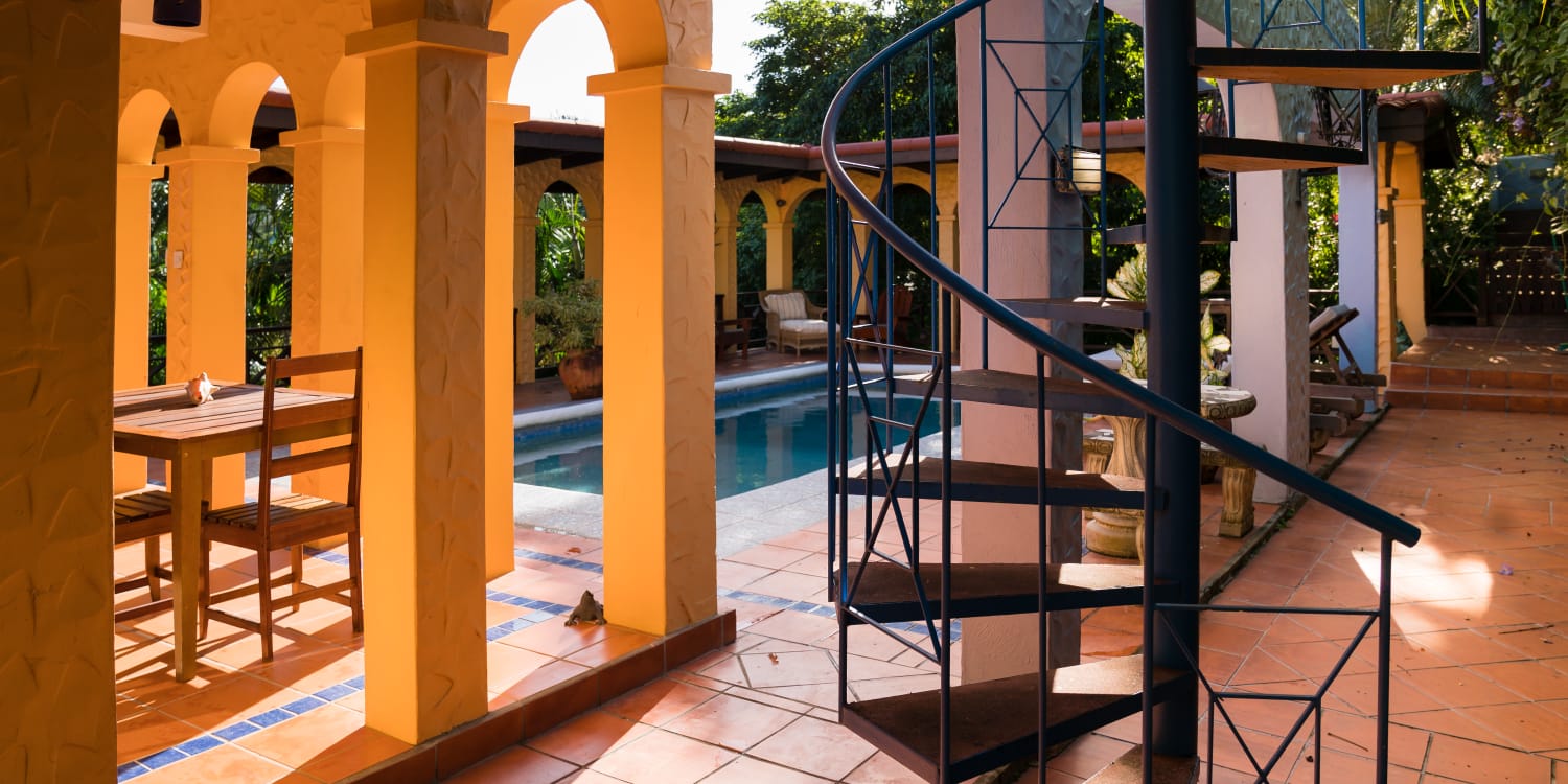 Villa entrance with palms